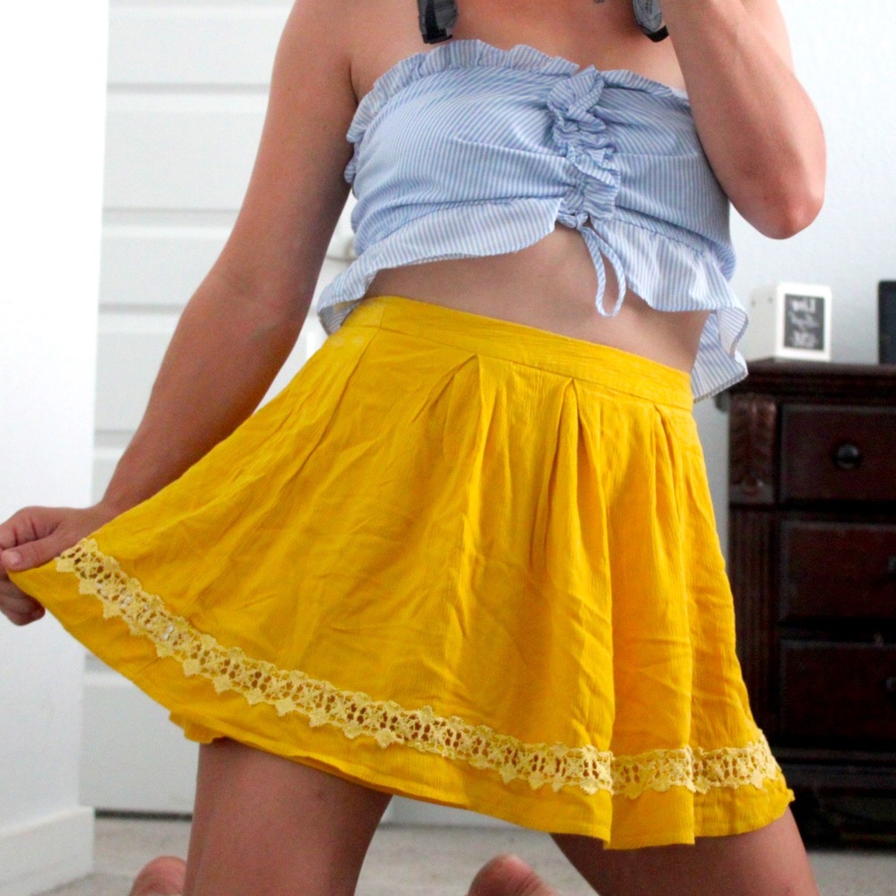 Yellow mini skater skirt with crochet style trim